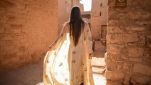 HINDAMME and Madrasat Addeera's artisans reimagine AlUla's ancient petroglyphs as modern abayas and shirts in a new slow-fashion collection.