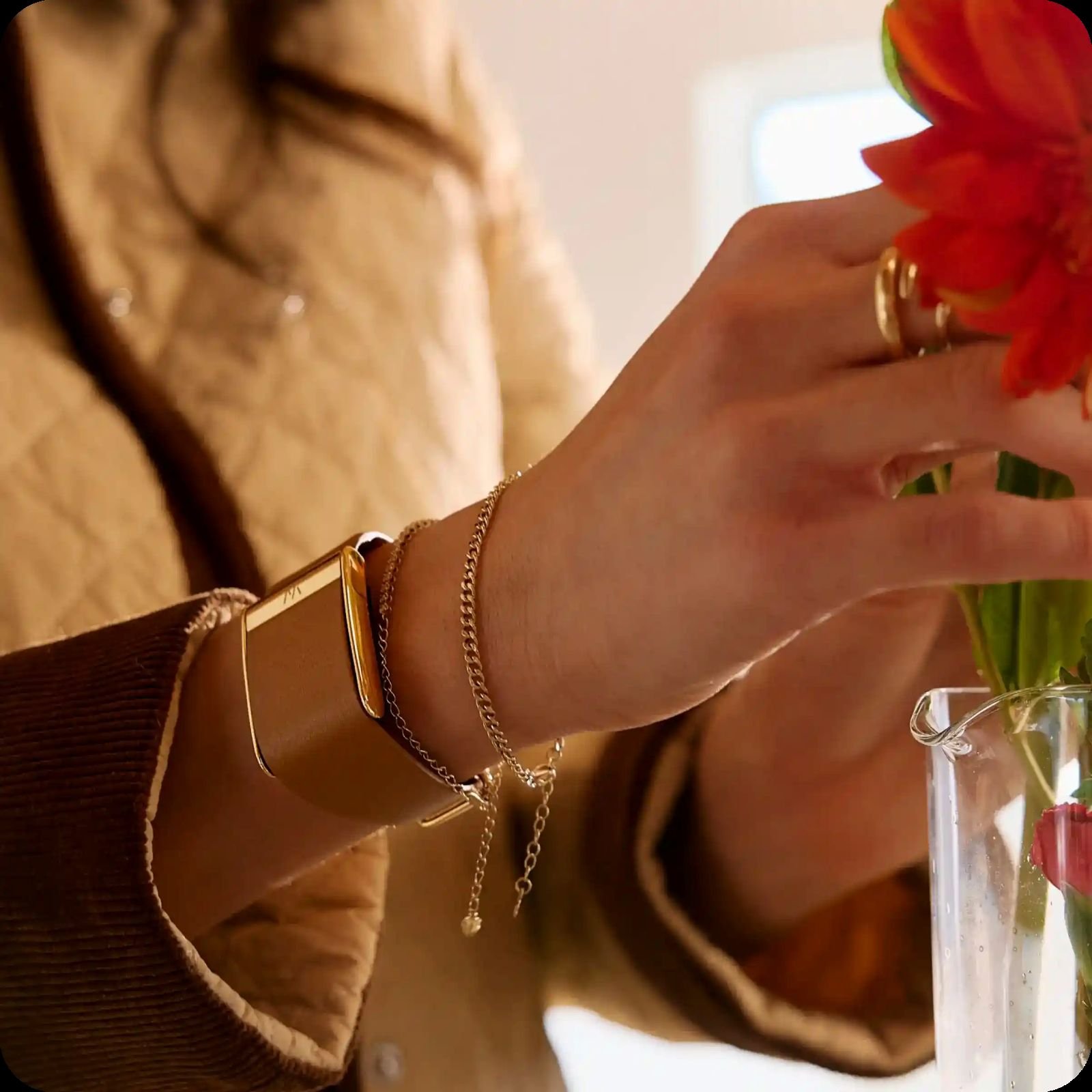Jewellery-inspired health wearables including smart rings and a metal fitness tracker bracelet.